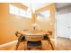 Cozy dining area featuring a round wooden table, stylish chairs, and a window letting in natural light at 2316 N Pennsylvania St # 1, Indianapolis, IN 46205