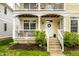 Inviting front entrance with a white door, lovely wreath, and well-maintained landscaping at 2316 N Pennsylvania St # 1, Indianapolis, IN 46205
