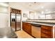 Well-equipped kitchen with stainless steel appliances, wooden cabinets, and laminate flooring at 2316 N Pennsylvania St # 1, Indianapolis, IN 46205