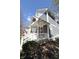 Charming two-story home with inviting front porch and manicured lawn at 2419 N Park Ave, Indianapolis, IN 46205