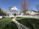 Charming two-story home with a well-maintained lawn, walkway, and inviting front porch at 2419 N Park Ave, Indianapolis, IN 46205