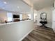 Inviting foyer with wood floors, light walls, and an open view of the living room, dining area, and kitchen at 2419 N Park Ave, Indianapolis, IN 46205
