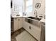 Bright kitchen featuring a stainless steel sink, white cabinets, and modern appliances at 2419 N Park Ave, Indianapolis, IN 46205