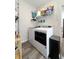 Efficient laundry room with modern washer, dryer, shelving, and ample storage at 2419 N Park Ave, Indianapolis, IN 46205