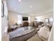 Bright and airy living room open to the dining area and kitchen, featuring comfortable seating and ample natural light at 2419 N Park Ave, Indianapolis, IN 46205