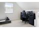 Home office setup with desk, computer, and comfortable chair in a well-lit room at 2419 N Park Ave, Indianapolis, IN 46205