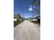 Quiet residential street featuring well-maintained lawns, garages, and classic lamp posts at 2419 N Park Ave, Indianapolis, IN 46205