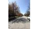 Peaceful street view with mature trees lining the road, offering shade and curb appeal at 2419 N Park Ave, Indianapolis, IN 46205