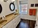 Bright bathroom with double sink vanity, ample counter space, and a window providing natural light at 2605 W Berkshire Dr, Muncie, IN 47304
