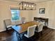 Elegant dining room featuring hardwood floors and a stylish light fixture at 2605 W Berkshire Dr, Muncie, IN 47304