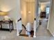 Inviting entryway with staircase, console table, and decorative lighting creates a warm and welcoming ambiance at 2605 W Berkshire Dr, Muncie, IN 47304