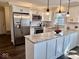 Eat-in kitchen with stainless appliances, granite counters, and white cabinetry at 2605 W Berkshire Dr, Muncie, IN 47304