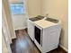 Laundry room featuring new washer and dryer units, hardwood floors and a window at 2605 W Berkshire Dr, Muncie, IN 47304