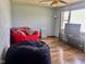 This living room offers hardwood floors, a bright window, comfy seating and neutral decor at 2715 S 300 E, Anderson, IN 46017