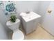 Bathroom with a gray vanity, white sink, and a toilet at 3140 Bonham Dr, Indianapolis, IN 46222