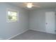 Comfortable bedroom featuring new carpeting, a ceiling fan, and a window at 3140 Bonham Dr, Indianapolis, IN 46222