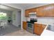 Traditional style kitchen featuring wooden cabinets, stainless steel appliances, and tile backsplash at 3140 Bonham Dr, Indianapolis, IN 46222