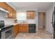 Functional kitchen with wood cabinets, stainless steel appliances, and ample counter space at 3140 Bonham Dr, Indianapolis, IN 46222