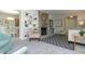 Open-concept living room showcasing a fireplace, adjacent dining area, and neutral decor at 3140 Bonham Dr, Indianapolis, IN 46222