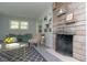 Inviting living room with a stone fireplace, built-in shelving, and comfortable seating arrangement at 3140 Bonham Dr, Indianapolis, IN 46222