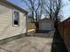 An overview of the backyard, showing a detached garage, and a wooden deck attached to the house at 3233 N Tacoma Ave, Indianapolis, IN 46218