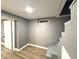 Finished basement with painted walls and recessed lighting, and a staircase with open risers at 3233 N Tacoma Ave, Indianapolis, IN 46218