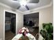 Charming dining area open to living area, featuring a ceiling fan and natural light at 3233 N Tacoma Ave, Indianapolis, IN 46218