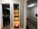 Hallway with built-in shelving unit, and views into bedroom areas at 3233 N Tacoma Ave, Indianapolis, IN 46218