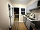 The kitchen is equipped with modern appliances and ample counter space at 3233 N Tacoma Ave, Indianapolis, IN 46218