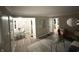 Open-concept living space leading into a dining area, bathed in natural light at 3233 N Tacoma Ave, Indianapolis, IN 46218