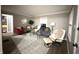 Bright living room with light gray walls, comfortable seating, and a view into other rooms at 3233 N Tacoma Ave, Indianapolis, IN 46218