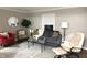 Cozy living room with gray sofa, accent chairs, glass table, light gray walls, and a recliner at 3233 N Tacoma Ave, Indianapolis, IN 46218