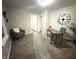 Sitting room with carpet, and neutral walls, plus a desk space by the door at 3233 N Tacoma Ave, Indianapolis, IN 46218