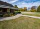 Community sand volleyball court next to a picnic pavilion with landscaping surrounding the green space at 3276 W Longbranch Dr, Monrovia, IN 46157