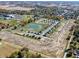 Aerial view of the Centre Place community with homes, pond, green spaces and mature trees at 3315 Godby Dr, Sheridan, IN 46069