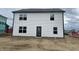 Home exterior featuring white siding and ample space for landscaping, along with many large windows at 3315 Godby Dr, Sheridan, IN 46069