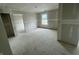 Spacious room with natural light and a neutral color scheme; walls are prepped for paint at 3315 Godby Dr, Sheridan, IN 46069