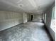 Large unfinished living space featuring ample room for furniture and natural light from large windows at 3315 Godby Dr, Sheridan, IN 46069