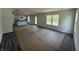 Bright living room showcases hardwood flooring and ample natural light from the windows at 3315 Godby Dr, Sheridan, IN 46069