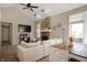 Bright living room with stone fireplace, neutral paint, and adjoined eat-in kitchen at 3510 Oak Tree Cir, Indianapolis, IN 46227