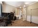 Home office with carpet, desk with computer, white wainscotting, and french doors at 3510 Oak Tree Cir, Indianapolis, IN 46227