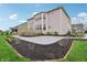 Well-maintained backyard featuring a lush green lawn, cozy deck, patio, and landscaped flowerbeds at 3665 Conifer Dr, Zionsville, IN 46077