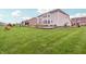 Spacious backyard featuring a well-kept lawn, wooden deck, and attractive landscaping at 3665 Conifer Dr, Zionsville, IN 46077