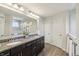 Bright bathroom with double vanity, granite countertop, and modern lighting at 3665 Conifer Dr, Zionsville, IN 46077