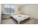 Cozy bedroom features carpet, a bed with floral bedding, and a window at 3665 Conifer Dr, Zionsville, IN 46077