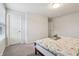 Bright bedroom featuring neutral colors, carpet, and simple furniture at 3665 Conifer Dr, Zionsville, IN 46077