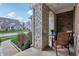 Charming covered patio with stone columns and view of adjacent home and neighborhood at 3665 Conifer Dr, Zionsville, IN 46077
