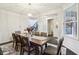 Charming dining area boasting modern lighting, neutral decor, and large windows for ample natural light at 3665 Conifer Dr, Zionsville, IN 46077