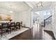 Bright dining room featuring hardwood floors, modern lighting, and a beautifully decorated table setting at 3665 Conifer Dr, Zionsville, IN 46077