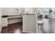 Small home office space with built-in desk and drawers offering convenient workspace with dark hardwood flooring at 3665 Conifer Dr, Zionsville, IN 46077